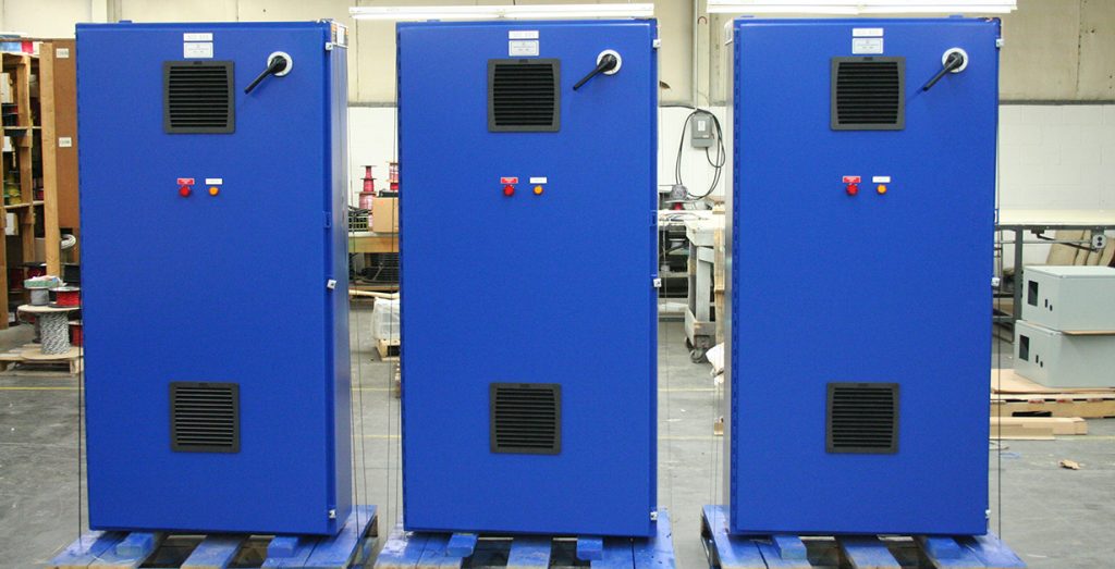 Three bright blue industrial control panels